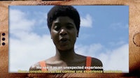 a woman with an afro in front of a cell phone